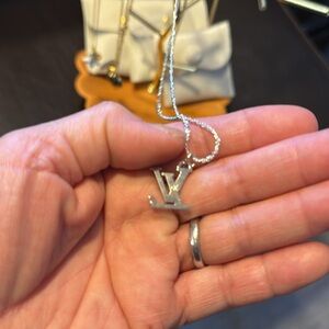 Silver Necklace with LV Pendant up cycled luxury bag charm on a silver necklace.